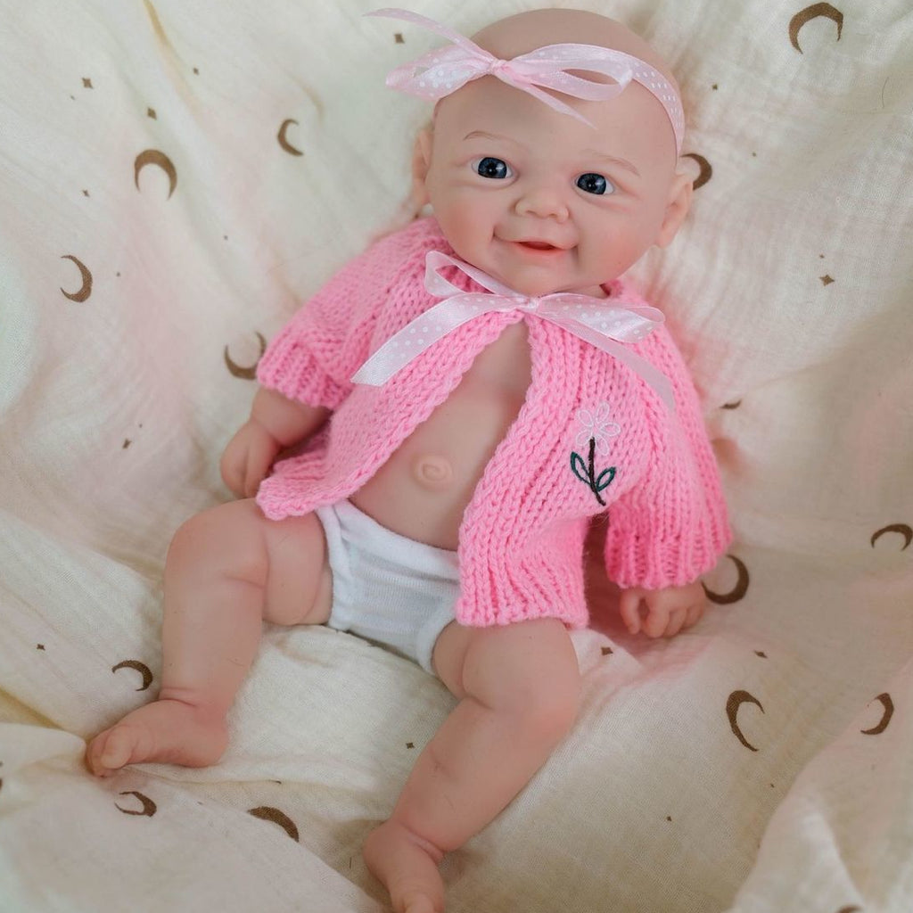 Muñeca bebé reborn de silicón sólido de 12 pulgadas Daisy Mae con boca abierta ✨ Extremidades elásticas, lavable, incluye conjunto de lazo de punto rosa